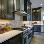 Modern,Kitchen,With,Brown,Kitchen,Cabinets,Paired,With,White,Countertops,