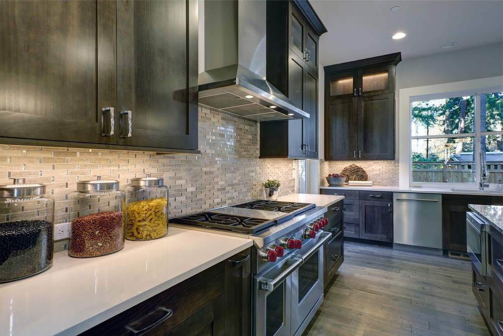 Modern,Kitchen,With,Brown,Kitchen,Cabinets,Paired,With,White,Countertops,