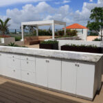 Upscale,Outdoor,Cabinets,With,Granite,Counter,Top,On,A,Rooftop