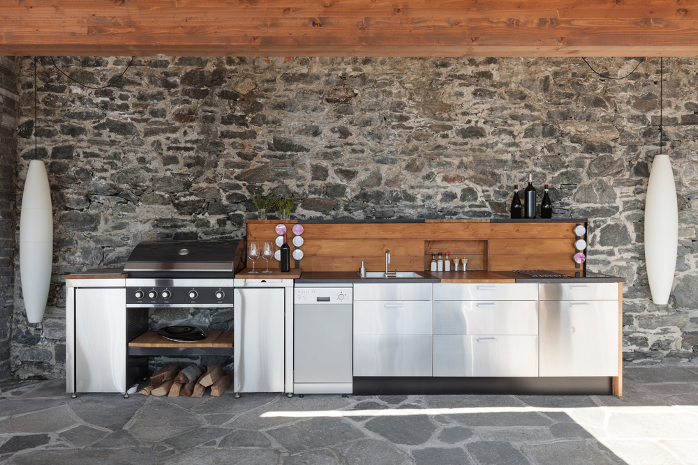 House,,Modern,Kitchen,With,Barbecue,On,The,Veranda
